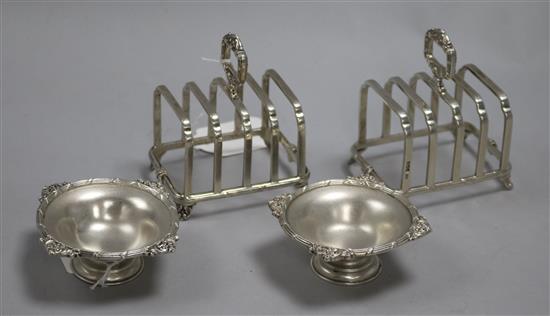 A pair of Mappin & Webb silver toast racks and a pair of brushed silver small pedestal dishes